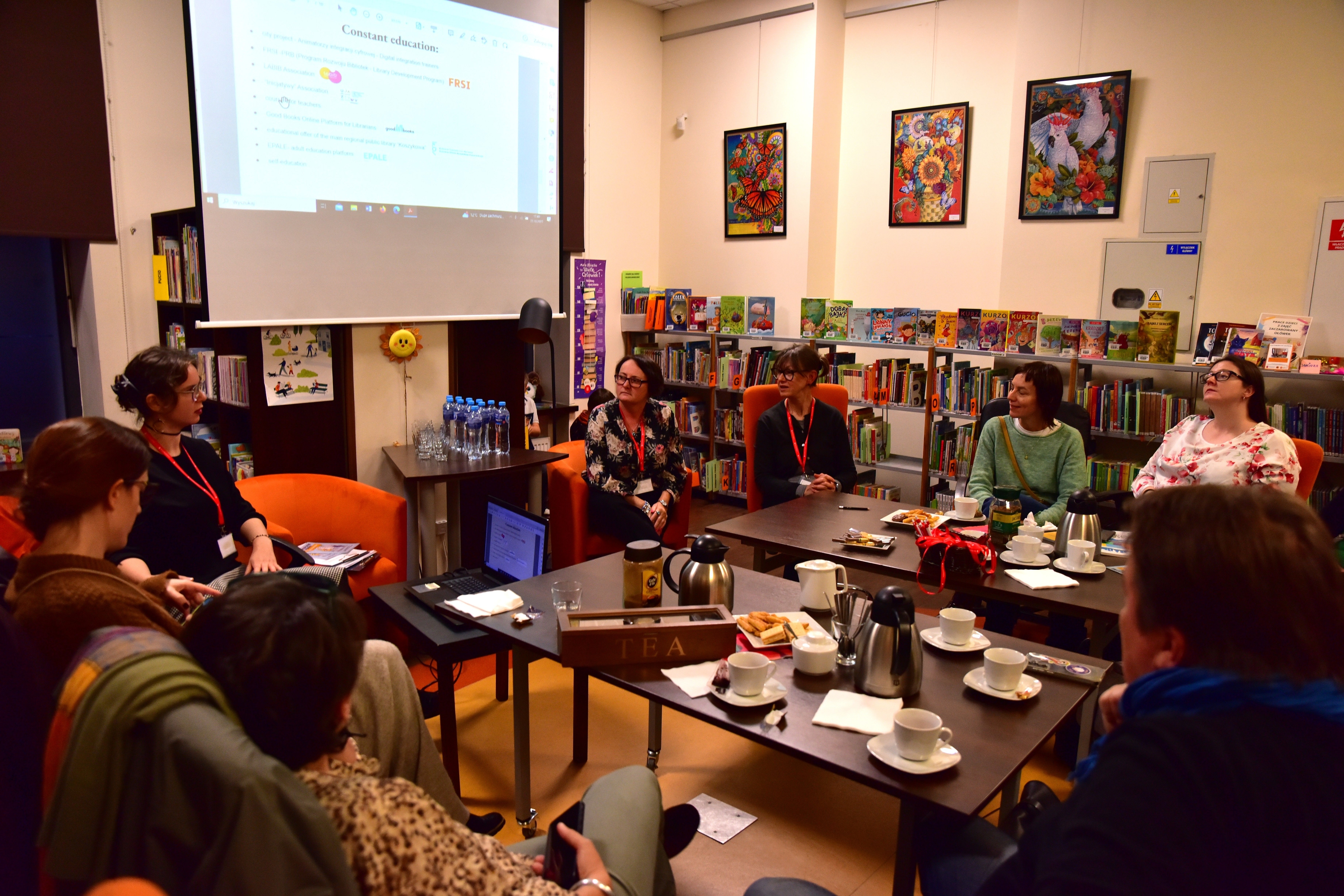 DigLib project partners around a table at Book Stop in Warsaw